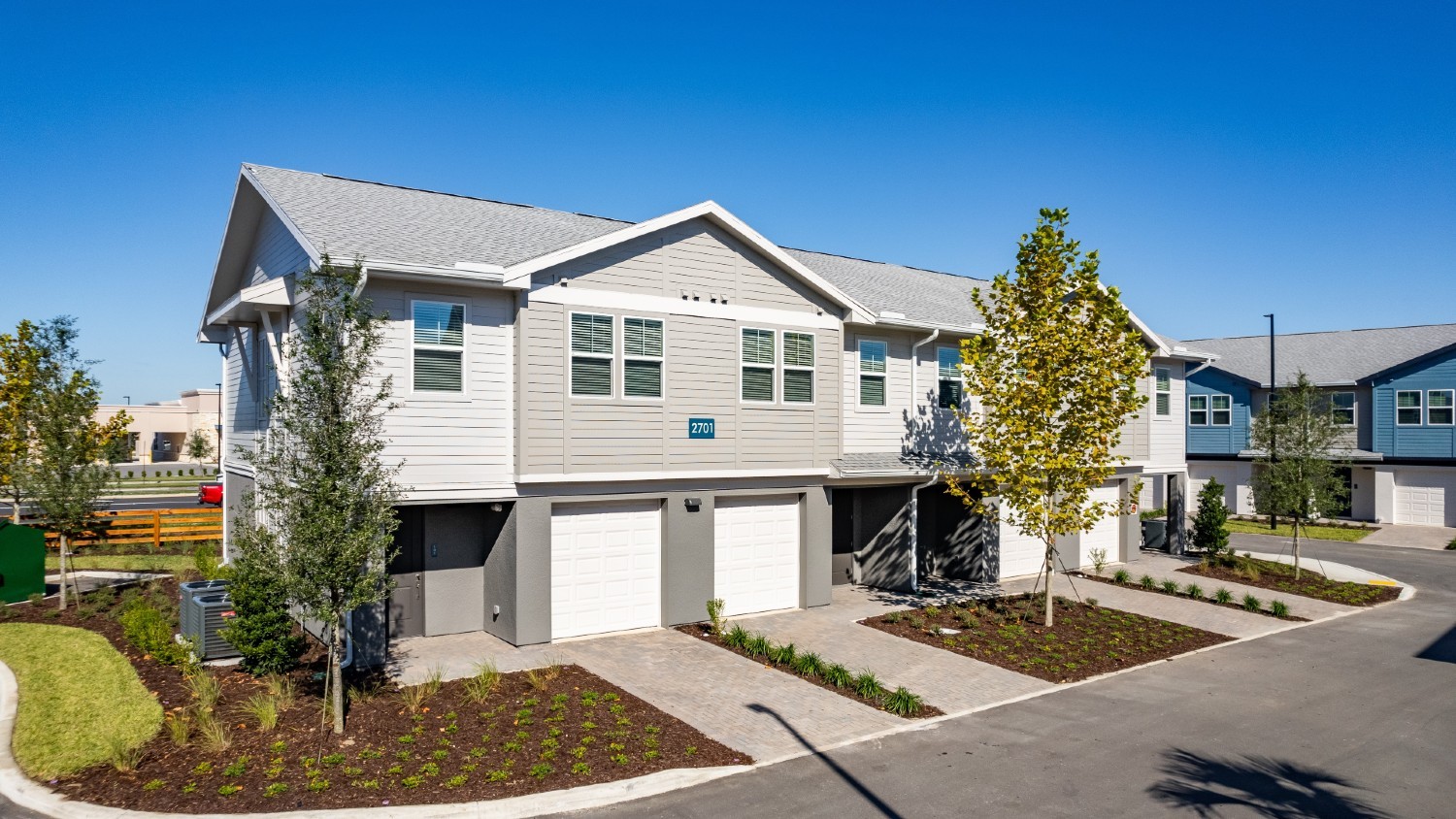 Attractive townhome exteriors with attached garages